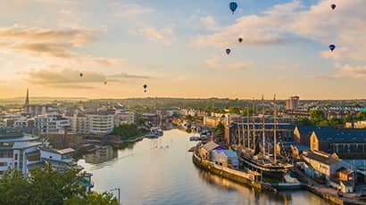 Cityscape of Bristol with hot air balloons in the sky