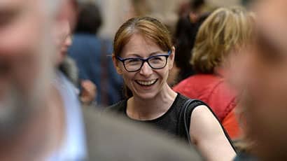 Smiling business lady in crowd