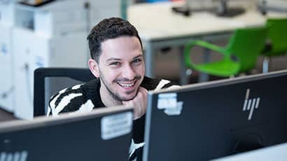 Smiling student at a PC