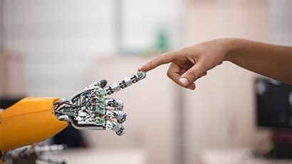 Robot and human index fingers touching