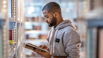 Student in library reading