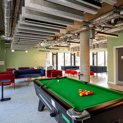 Students chatting in shared kitchen space