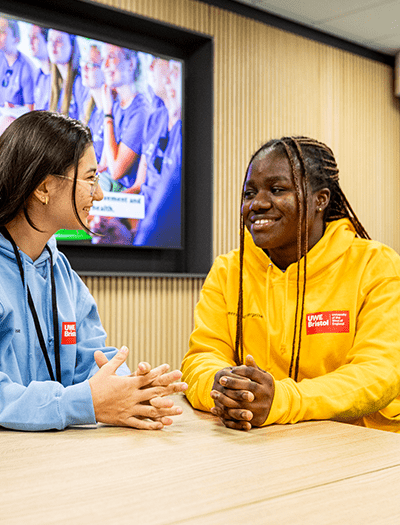 Student career advisors talking to each other at a table