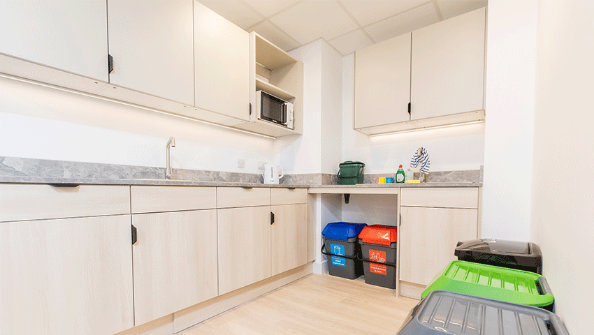 Kitchen area with recycling.
