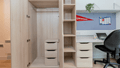 A close up of the bedroom storage at Kingfisher Court, including wardrobe hanging space and drawers.