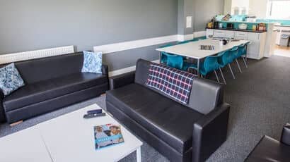 Typical communal area in Wallscourt Park with sofas and a coffee table.