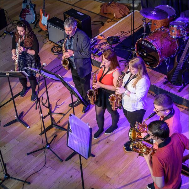 Saxfaction group performing on saxaphones