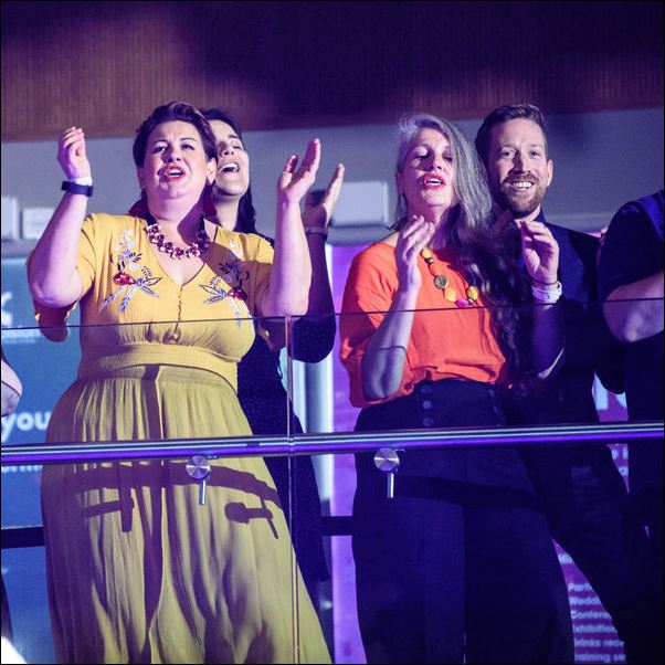 Singers clapping hands