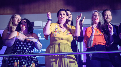 Group of singers singing and clapping