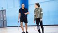 Students walking on court to play badminton at the Centre for Sport.