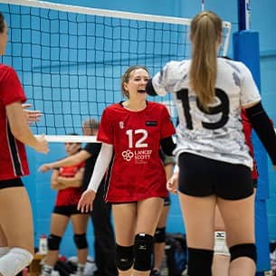 Women's Volleyball team mid-game.