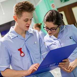 two nursing students in a hospital ward
