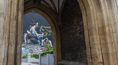 Bristol street art through historical arch