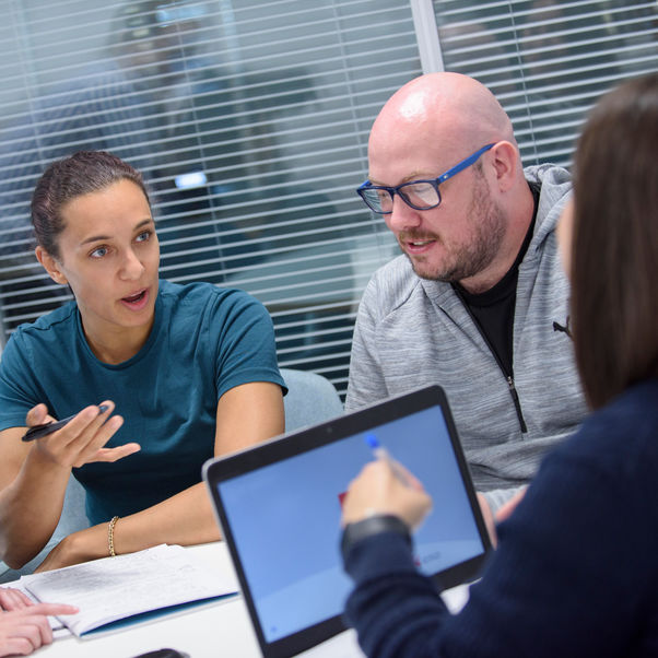 Students in the Business Advice Centre working with business partners