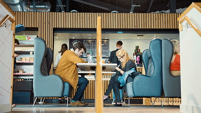 People sat at The Students' Union at UWE bar.