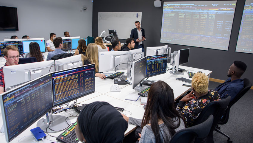 Long shot of the Bloomberg Room full of students