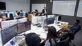 Long shot of the Bloomberg Room full of students