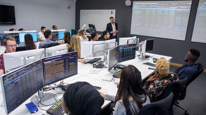 Students and teacher in the Bloomberg Room