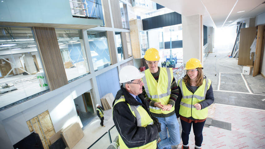 Students in the Business School as it is being constructed