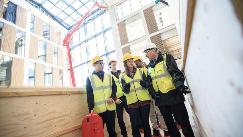 Students inside the building as construction is in full swing