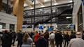 Photo of the opening party for the engineering building with lots of people walking around the ground floor area