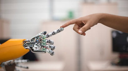 Fingertips touching of a person and a robotic hand