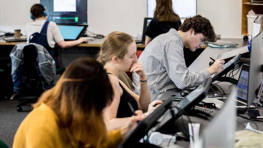 Students sat at computers