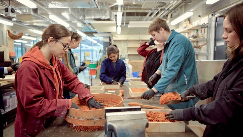 Students working with clay