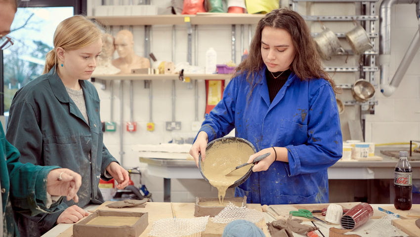 A student working with clay