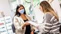 A student Optometrist discussing eye test results with a patient.