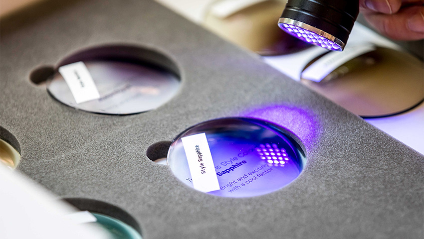 A close-up of a lens undergoing the verification process by an Optometrist.