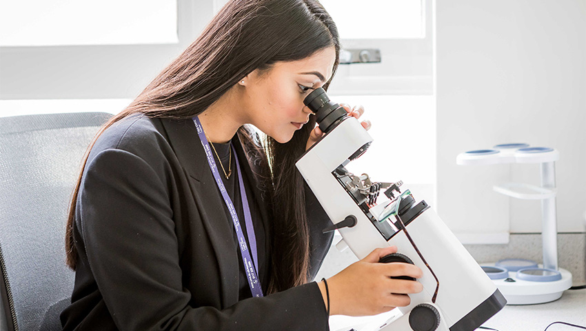 Student Optometrist conducting a verification process for spectacle lenses.