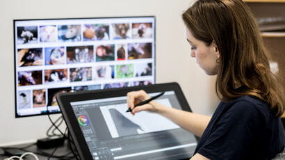 Student editing film using touch display facilities at City Campus