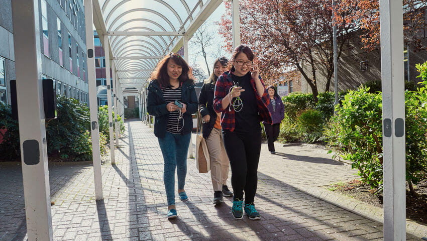 Students walking around Frenchay Campus