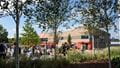 The Students' Union building on Frenchay Campus through the trees