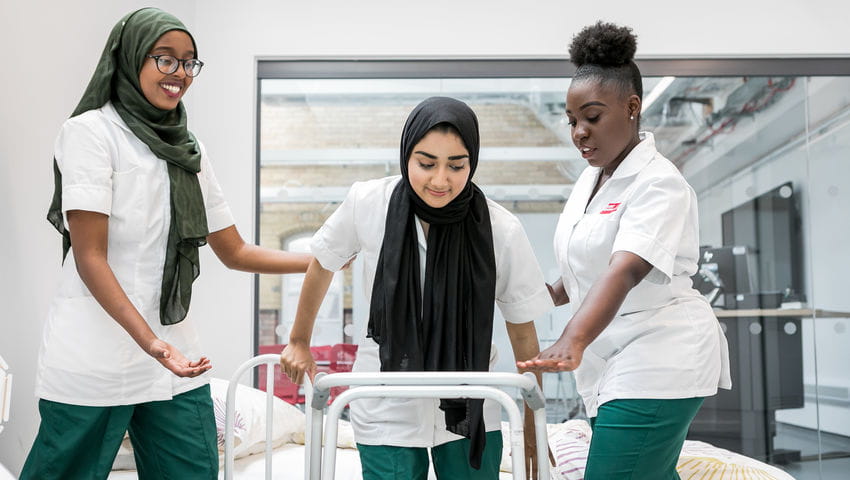 Occupational therapy students using equipment 