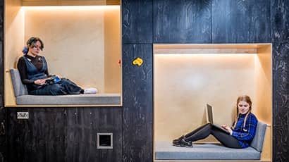 Students sitting in quiet study pods.