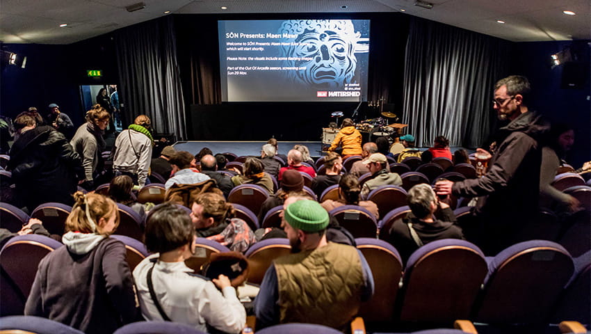 People taking their seats in Watershed cinema.