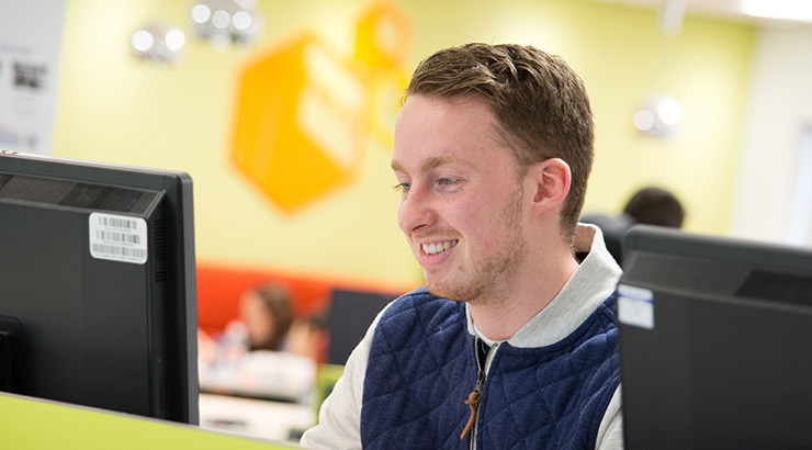 Male student working on computer