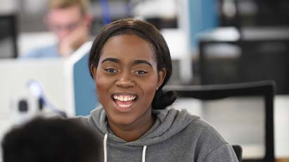 Students talking in a library