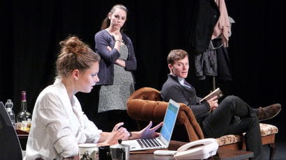 Drama students acting on stage in a studio