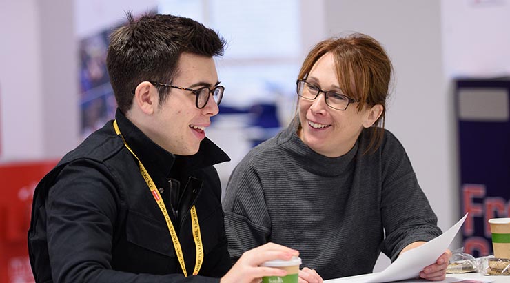 Prospective student and parent chatting at Open Day