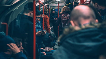 People commuting on a busy train