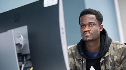 Student working on a desktop computer