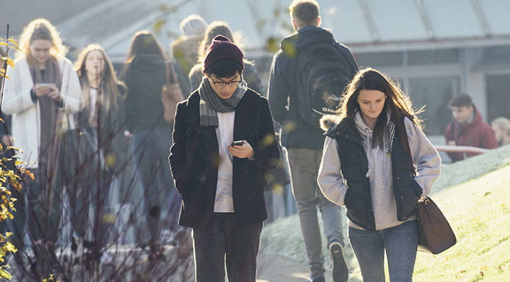 Students walking outside on campus