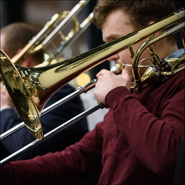 Students playing brass instruments