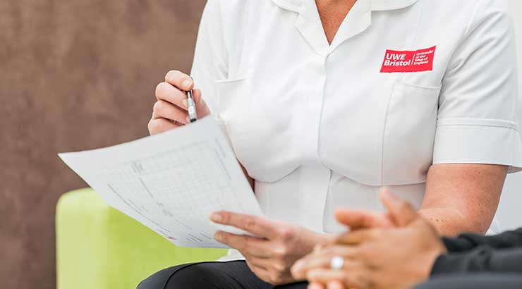 Close up of student nurse holding a document