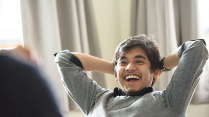 A male student laughing