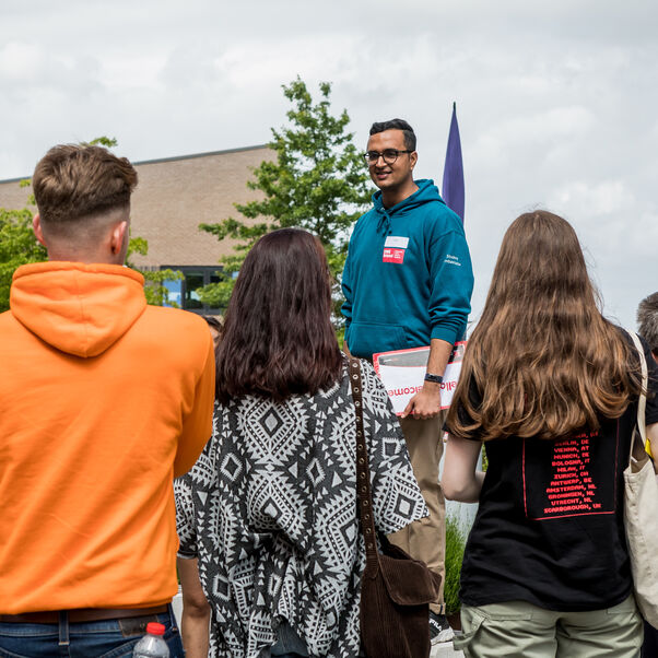 A group of prospective students a given a guided tour by a UWE representative. 