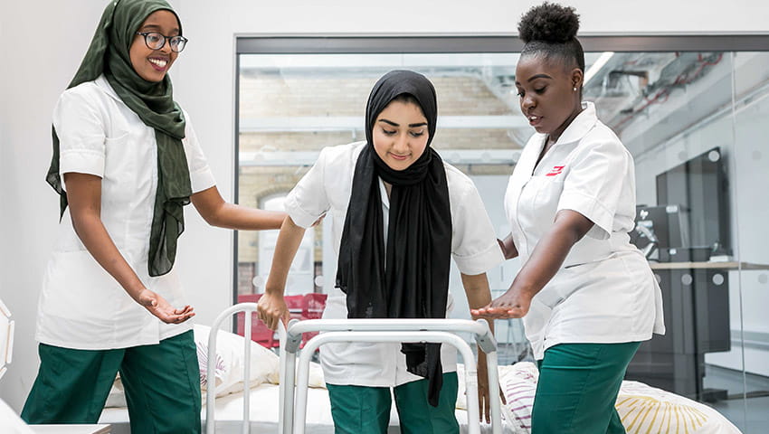Occupational Therapy students practising techniques in clinical environment 